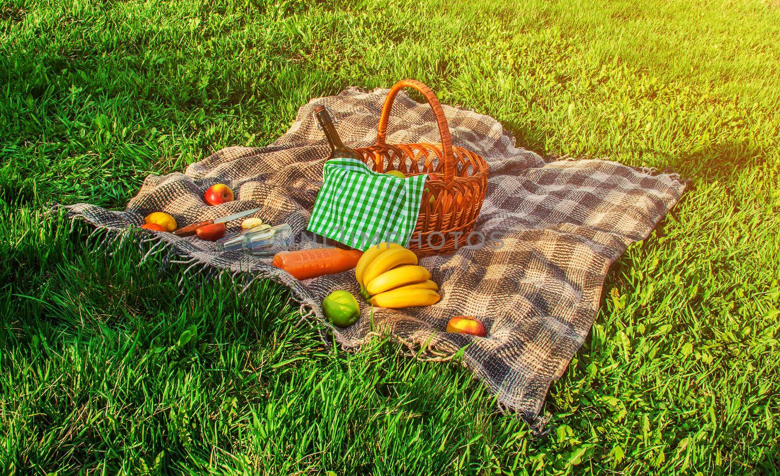 Plaid for a picnic on the grass. Selective focus.
