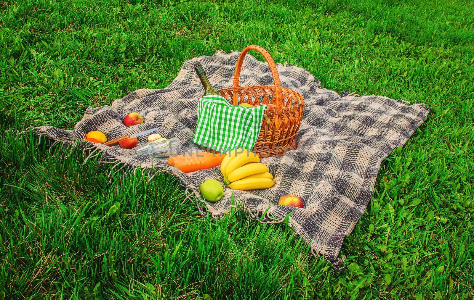 Plaid for a picnic on the grass. Selective focus.