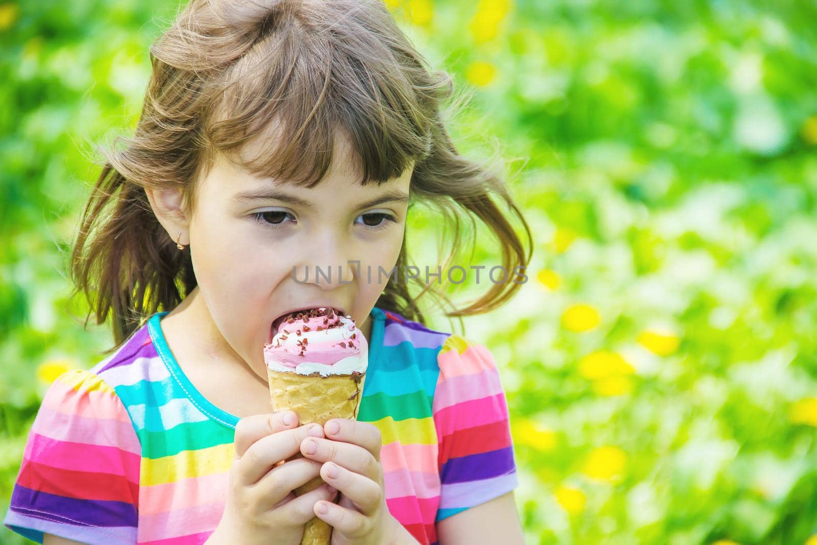 The child eats ice cream. Selective focus. by yanadjana