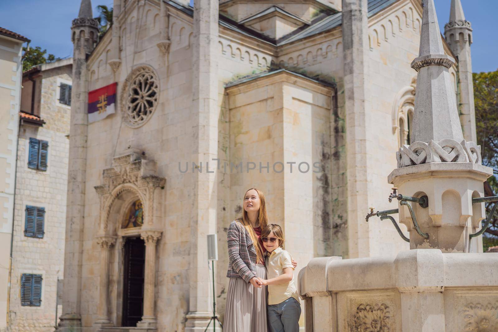 Mom and son tourists in Herceg Novi old town. Historical and touristic center of Herceg Novi. Montenegro.
