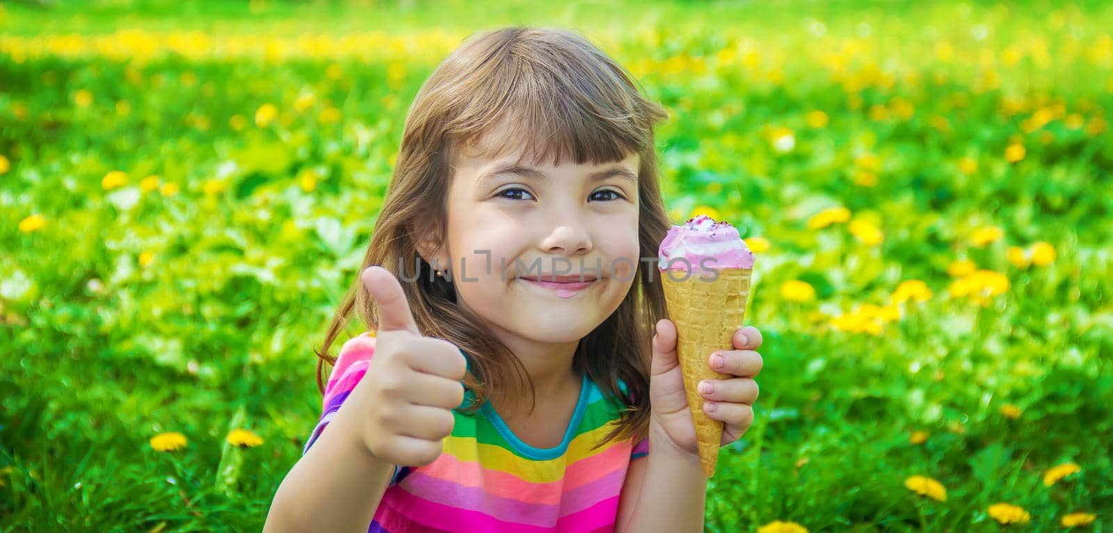 The child eats ice cream. Selective focus. by yanadjana