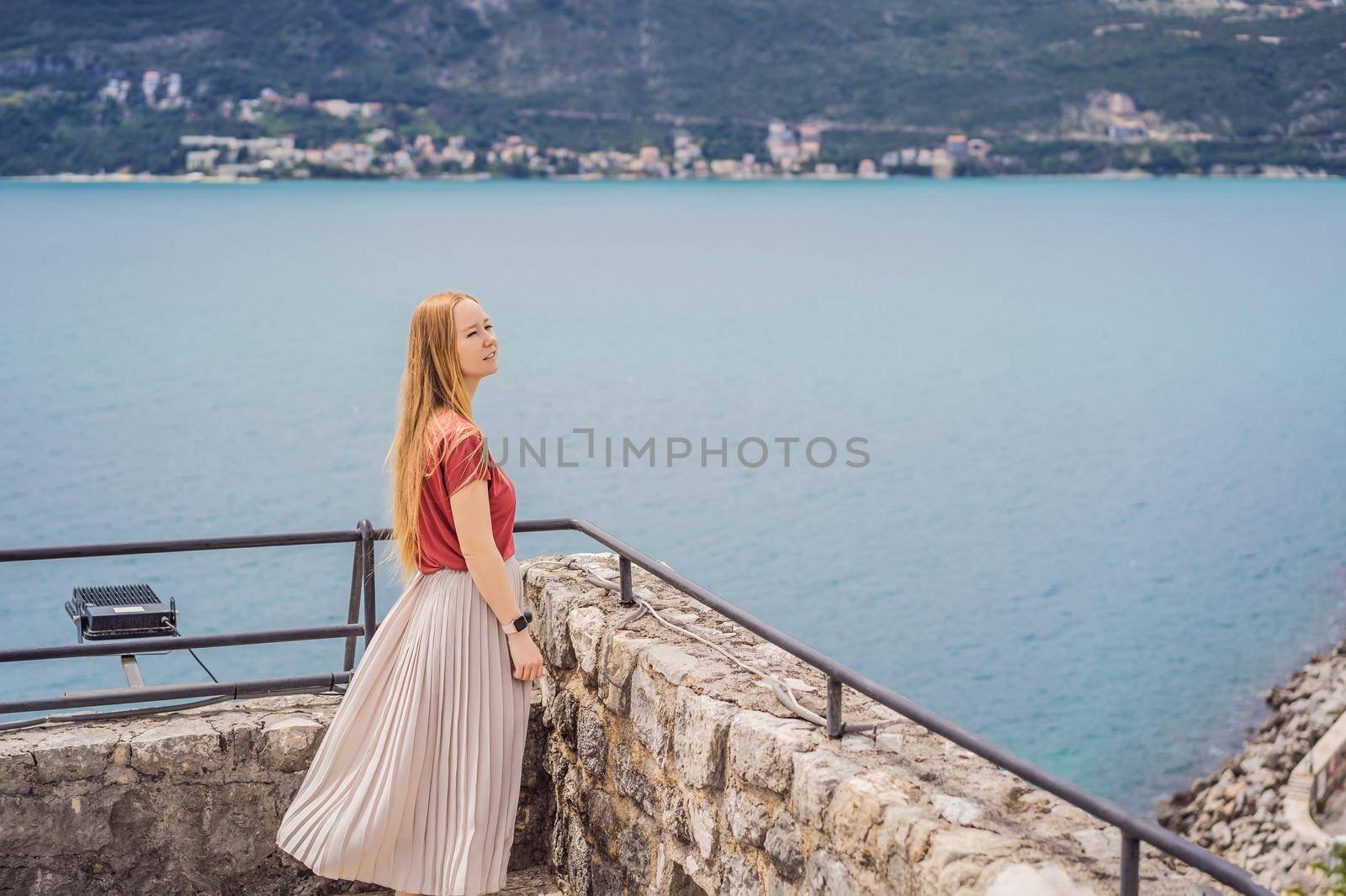 Woman tourist in Herceg Novi old town. Historical and touristic center of Herceg Novi. Montenegro.