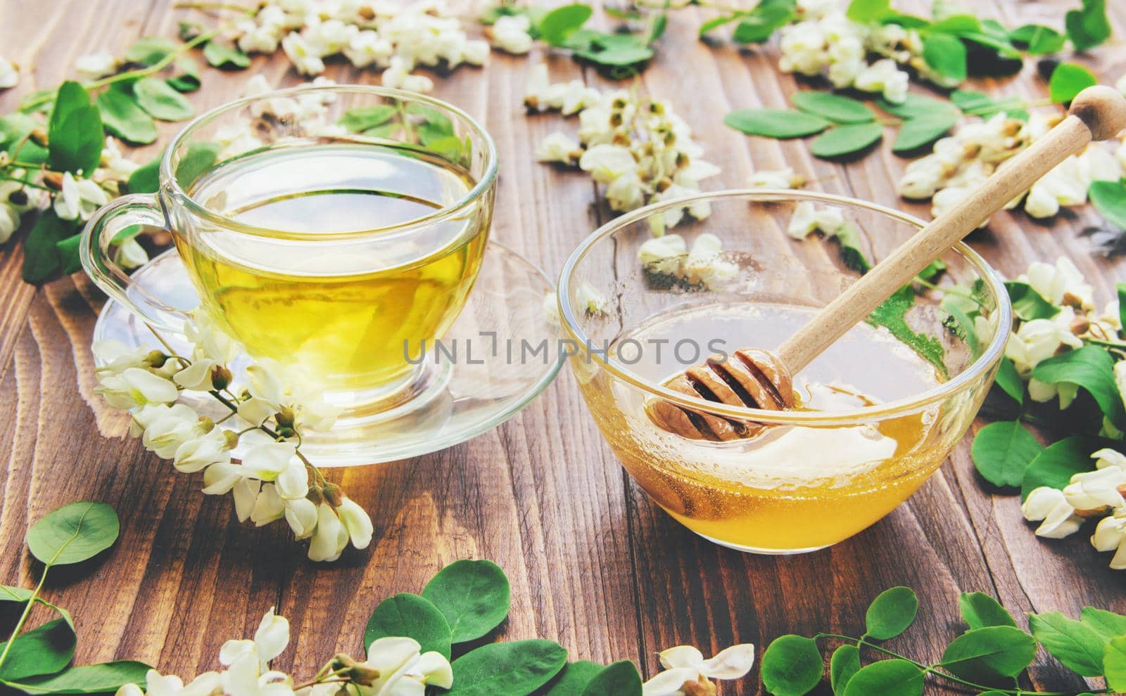 Honey with acacia and tea. Selective focus. by yanadjana