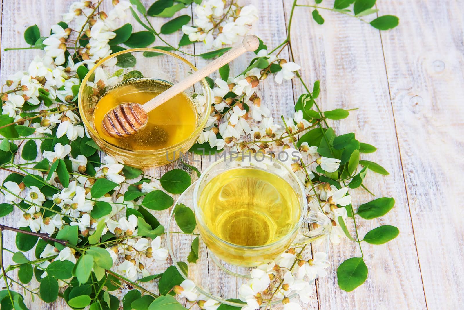 Honey with acacia and tea. Selective focus.