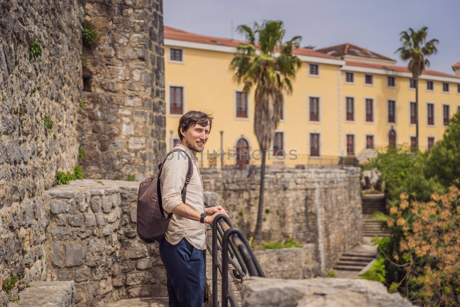 Man tourist in Herceg Novi old town. Historical and touristic center of Herceg Novi. Montenegro.