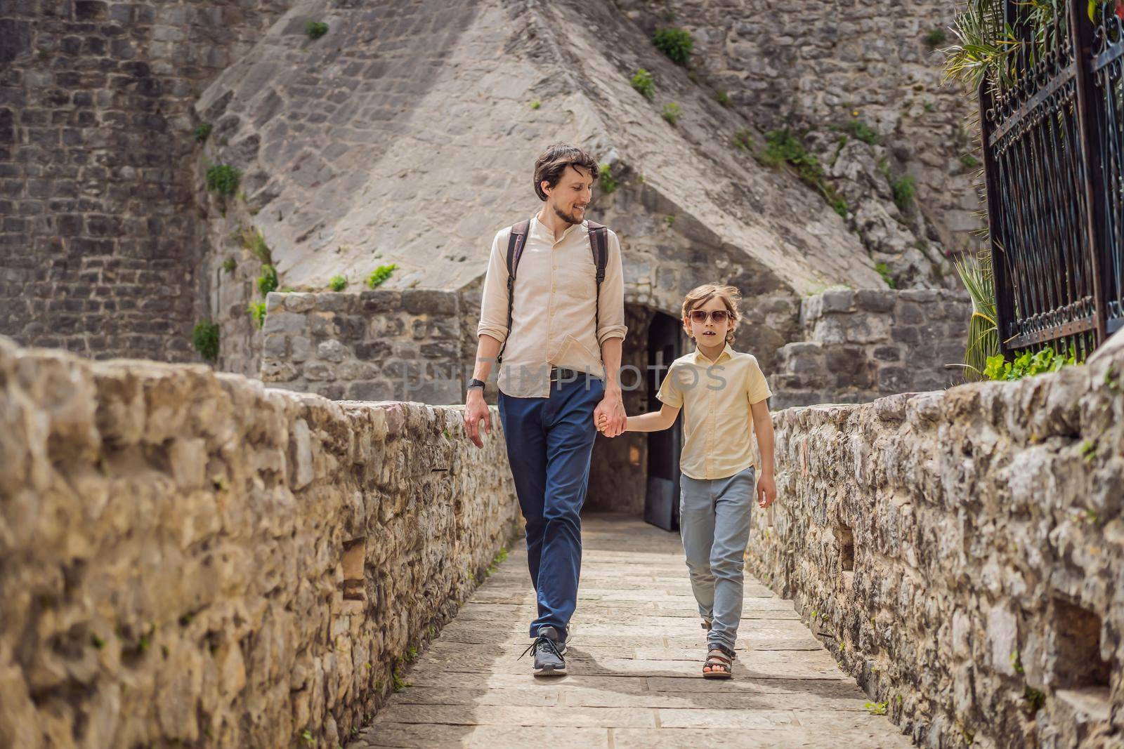 Father and son tourists in Herceg Novi old town. Historical and touristic center of Herceg Novi. Montenegro.