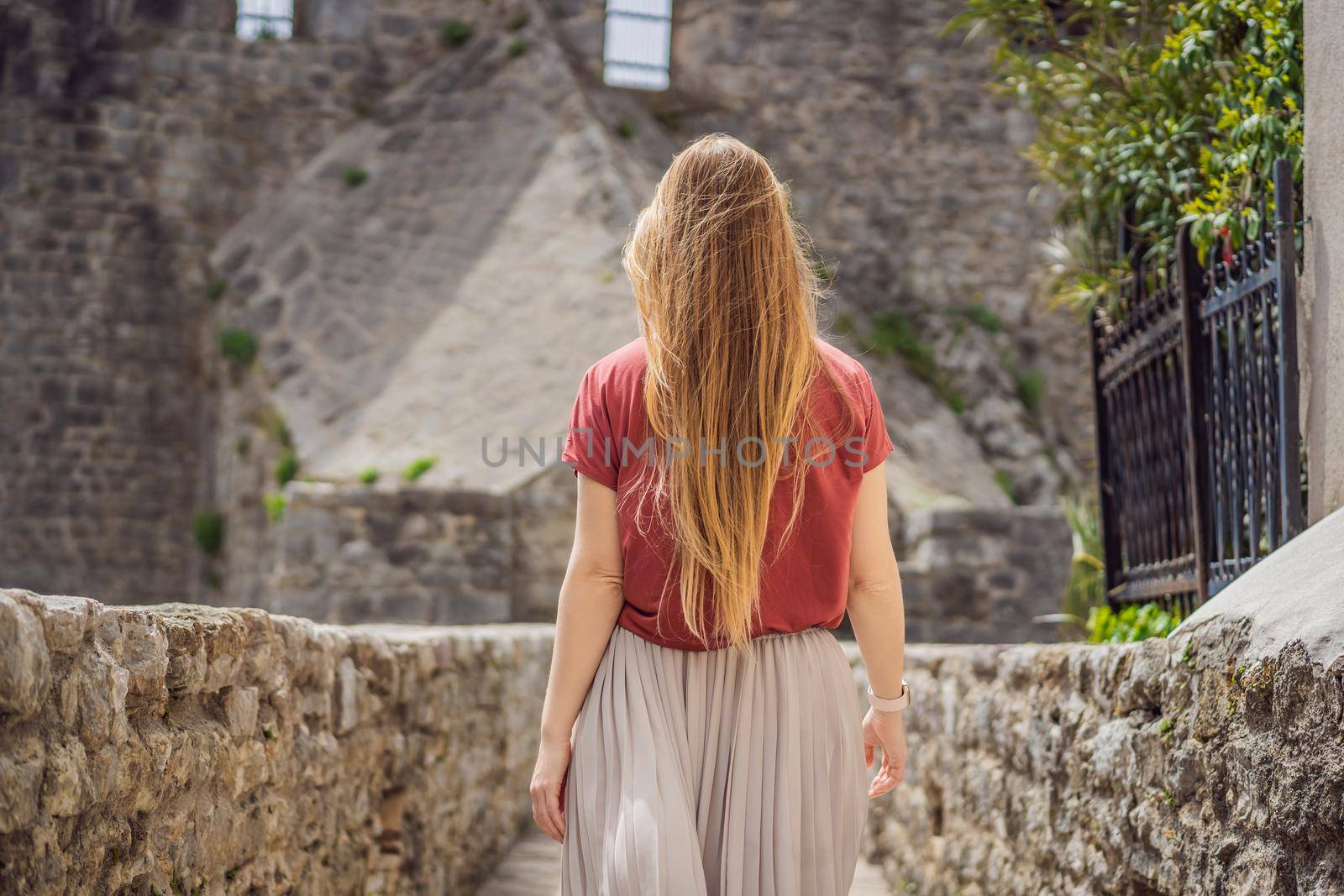 Woman tourist in Herceg Novi old town. Historical and touristic center of Herceg Novi. Montenegro.
