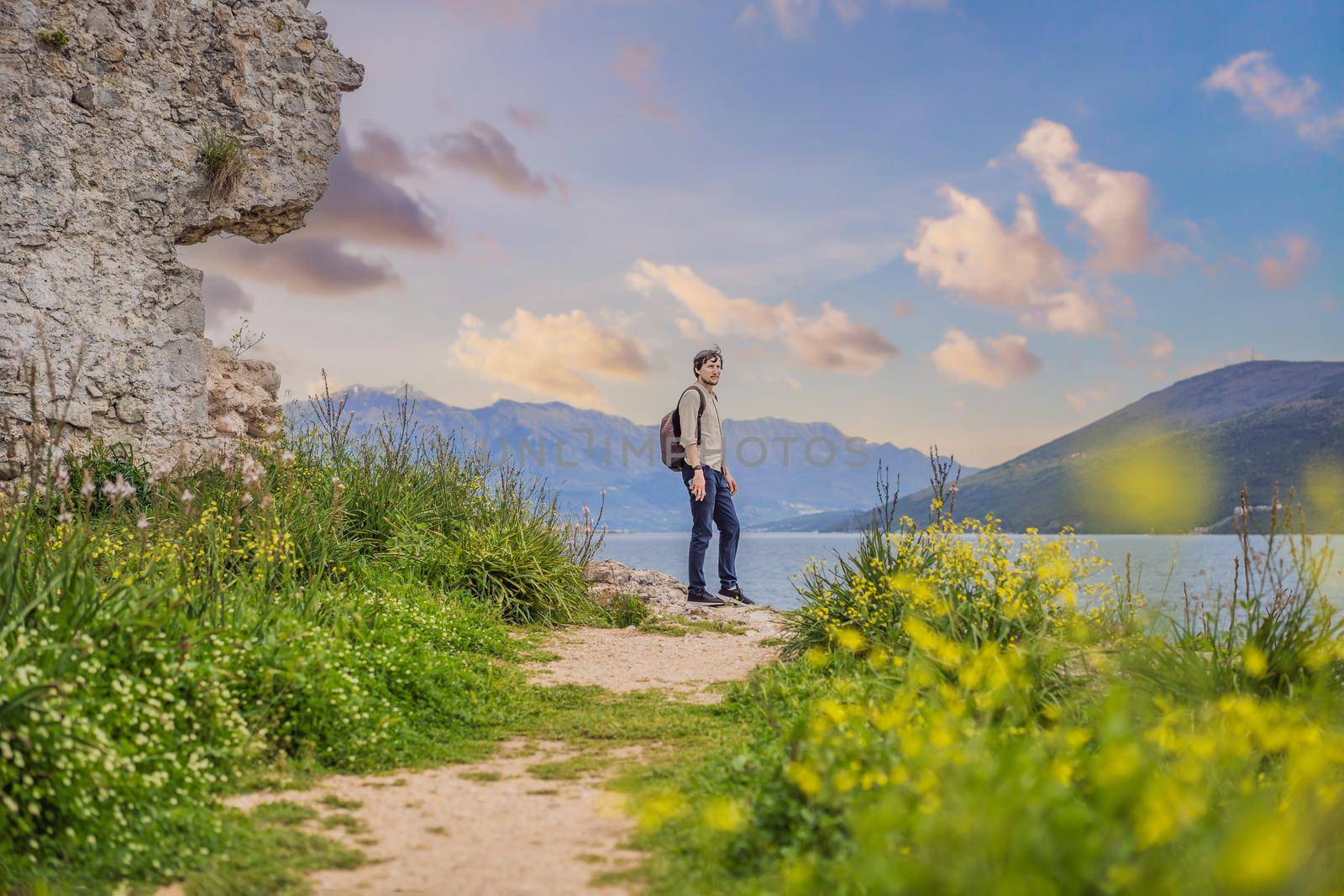 Man tourist in Herceg Novi old town. Historical and touristic center of Herceg Novi. Montenegro.