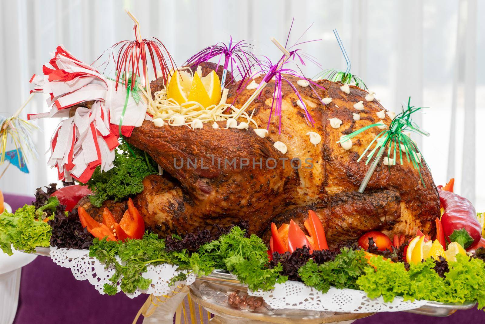 A large roast turkey on the holiday table at Thanksgiving