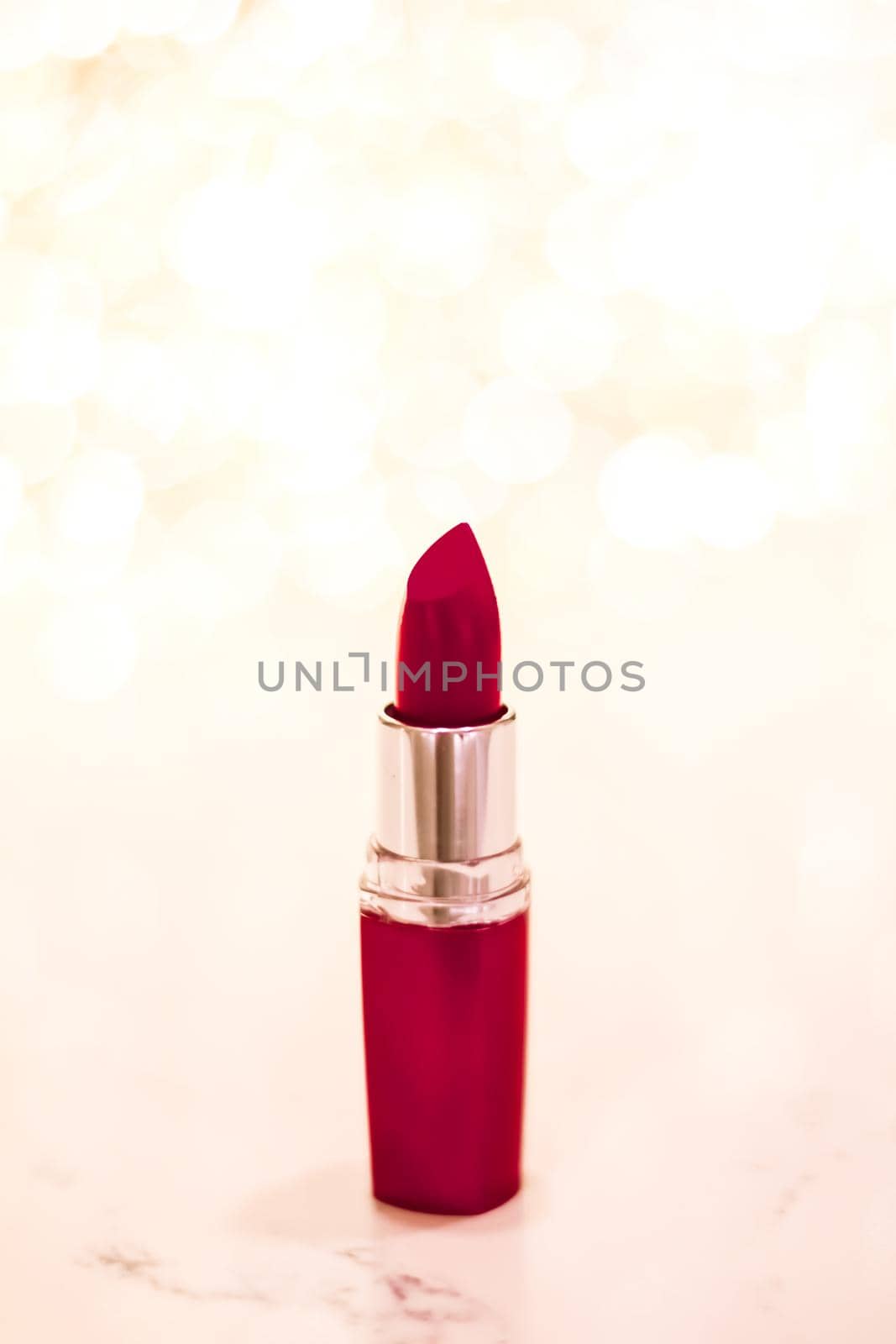 Cosmetic branding, sale and glamour concept - Dark red lipstick on golden Christmas, New Years and Valentines Day holiday glitter background, make-up and cosmetics product for luxury beauty brand