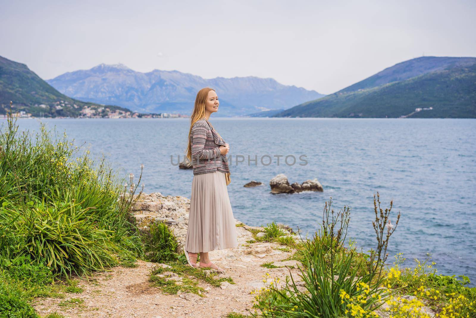 Woman tourist in Herceg Novi old town. Historical and touristic center of Herceg Novi. Montenegro.