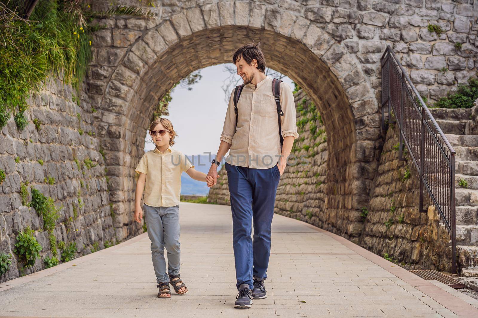 Father and son tourists in Herceg Novi old town. Historical and touristic center of Herceg Novi. Montenegro.