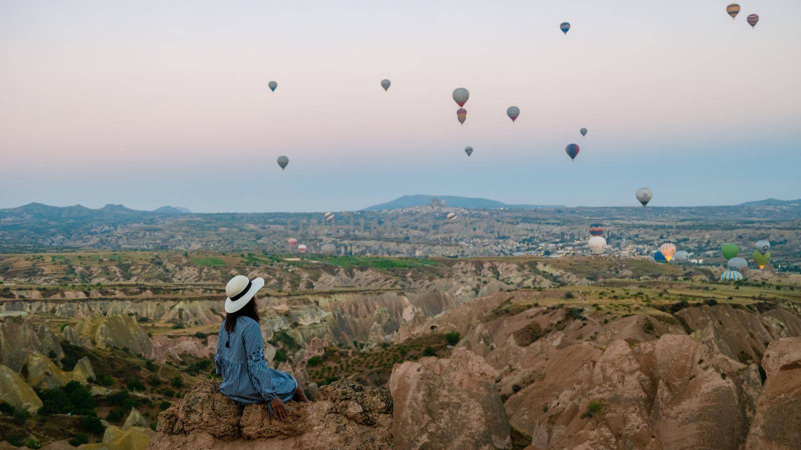 Asian women in hot air balloon during sunrise in Cappadocia Turkey, Kapadokya Goreme by fokkebok