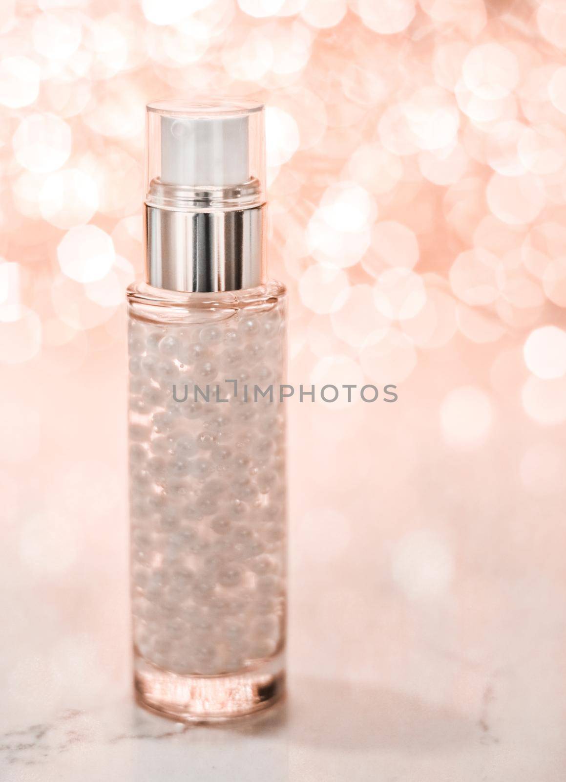 Cosmetic branding, blank label and glamour present concept - Holiday make-up base gel, serum emulsion, lotion bottle and rose gold glitter, luxury skin and body care cosmetics for beauty brand ads