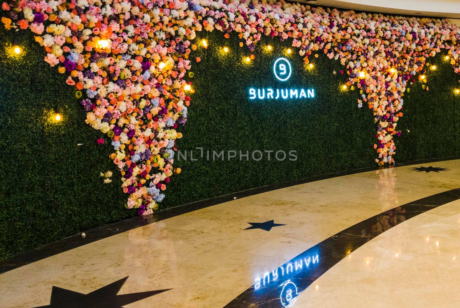 Dubai, UAE - 09.26.2022 - Flower wall installation in Burjman shopping mall