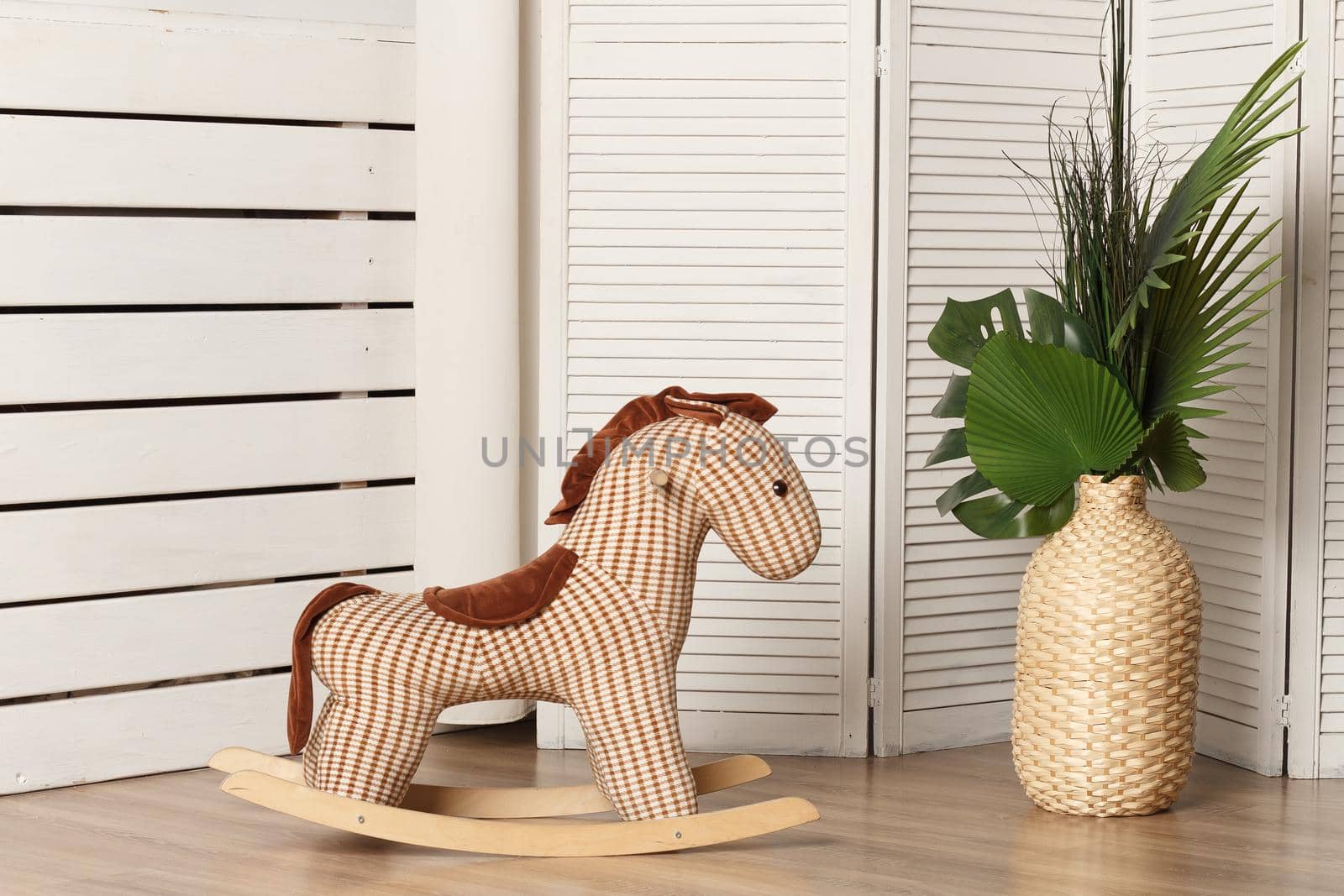 Brown rag horse for a rocking chair in the interior