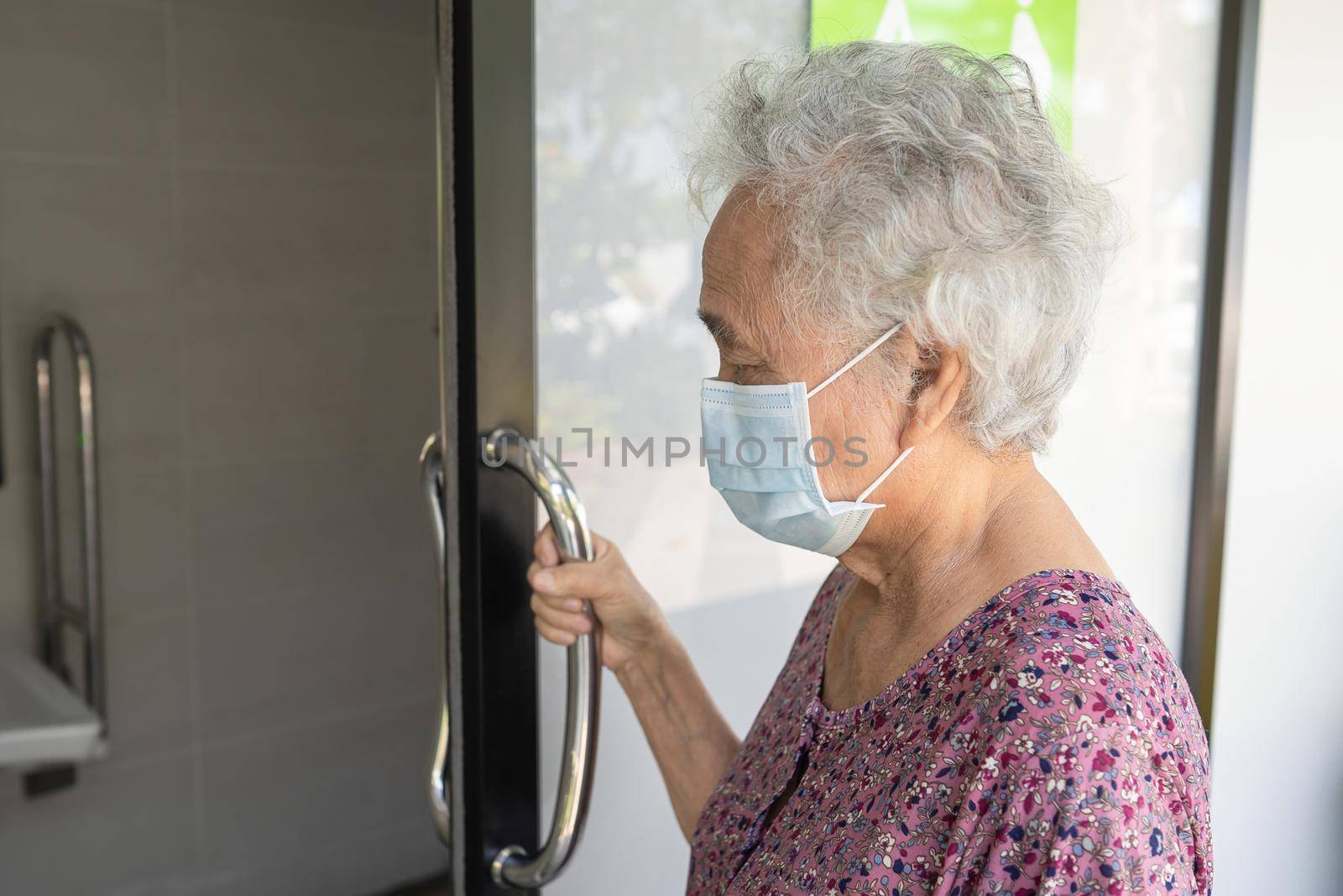 Asian senior or elderly old lady woman patient use toilet bathroom handle security in nursing hospital ward, healthy strong medical concept.