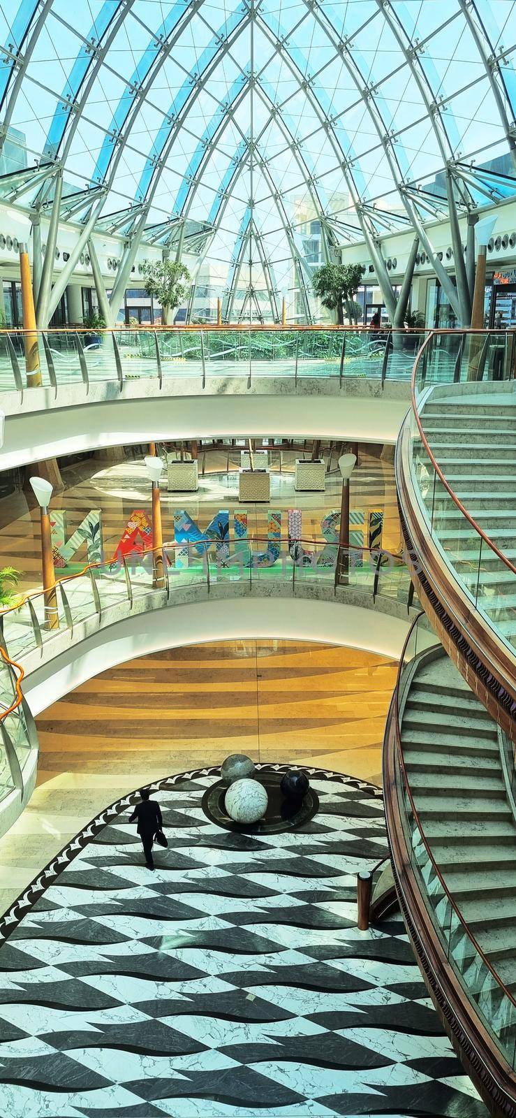 Dubai, UAE - 09.26.2022 - Staircase in the lobby of the Burjman shopping mall.