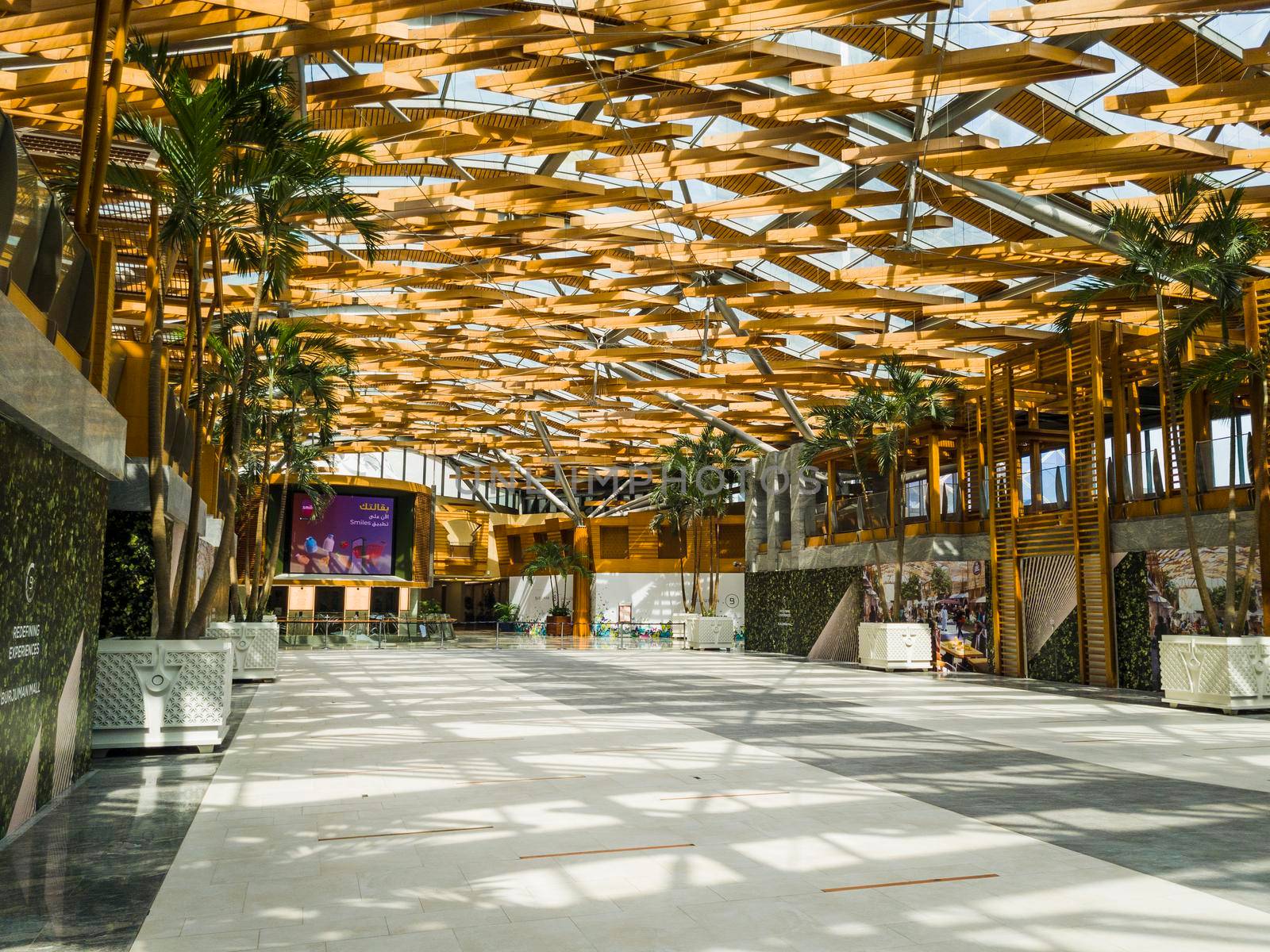 Dubai, UAE - 09.26.2022 - Hall with wooden ceiling installation in the Burjman shopping mall.
