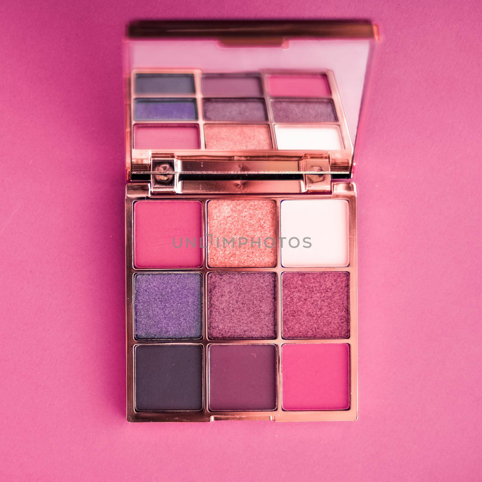 Cosmetic branding, mua and girly concept - Eyeshadow palette and make-up brush on pink background, eye shadows cosmetics product as luxury beauty brand promotion and holiday fashion blog design