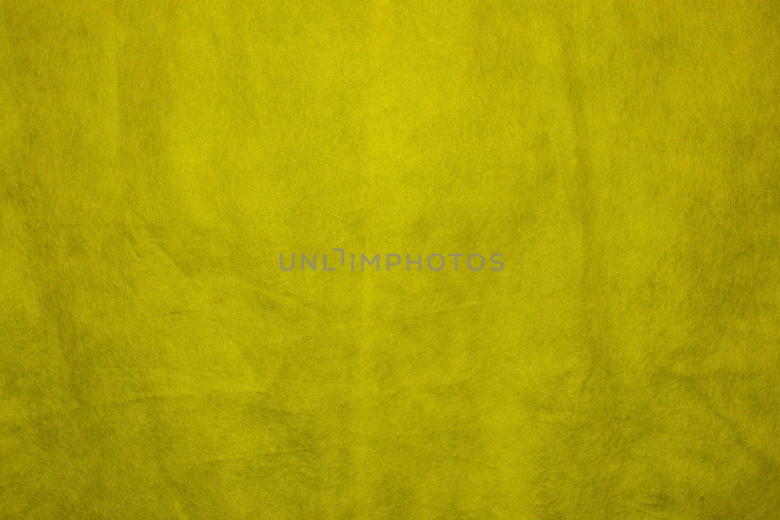 Fabric texture for design with copy space. Yellow abstract background with copy space.