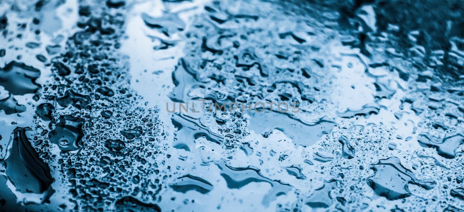 Water texture abstract background, aqua drops on blue glass as science macro element, rainy weather and nature surface art backdrop for environmental brand design by Anneleven