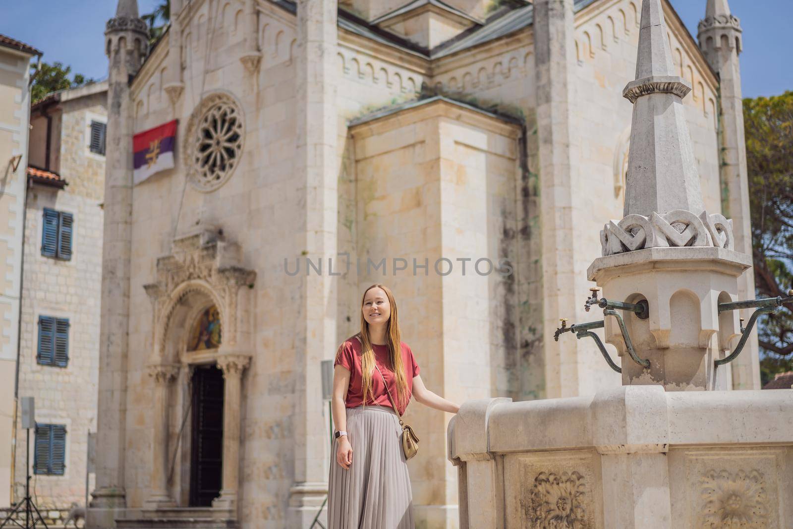 Woman tourist in Herceg Novi old town. Historical and touristic center of Herceg Novi. Montenegro.