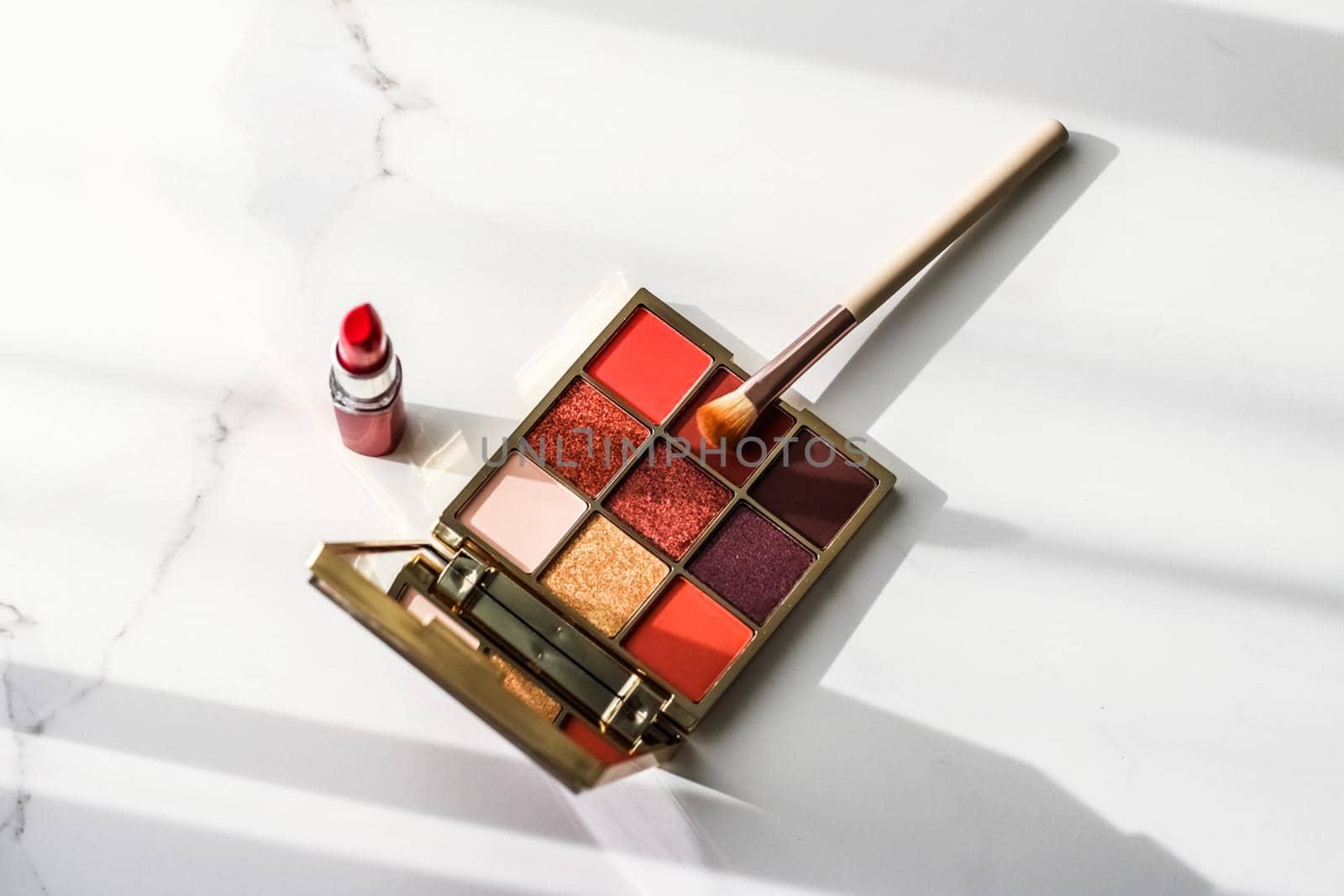 Cosmetic branding, girly and glamour concept - Cosmetics, makeup products set on marble vanity table, lipstick, eyeshadows and make-up brush for luxury beauty and fashion brand ads, holiday design