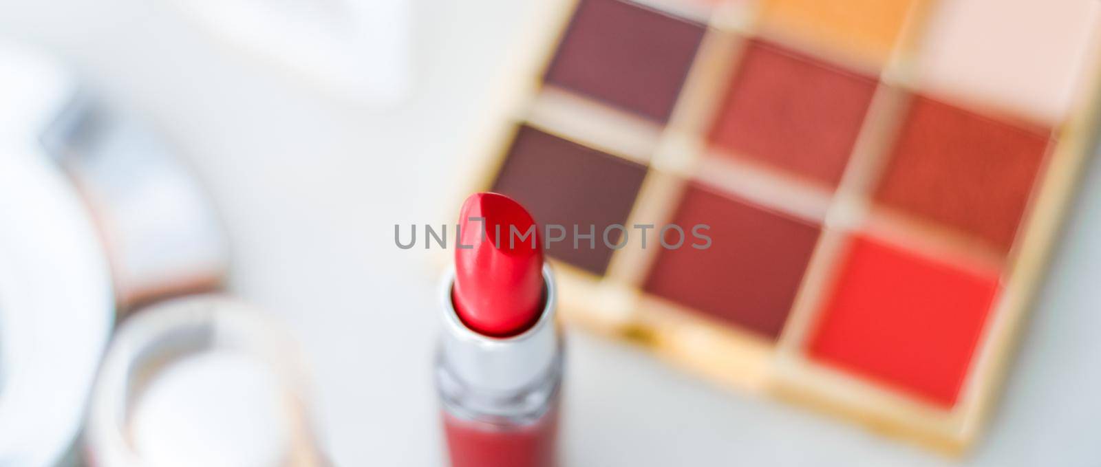 Cosmetics, makeup products on dressing vanity table, lipstick, foundation base, nailpolish and eyeshadows for luxury beauty and fashion brand ads design by Anneleven