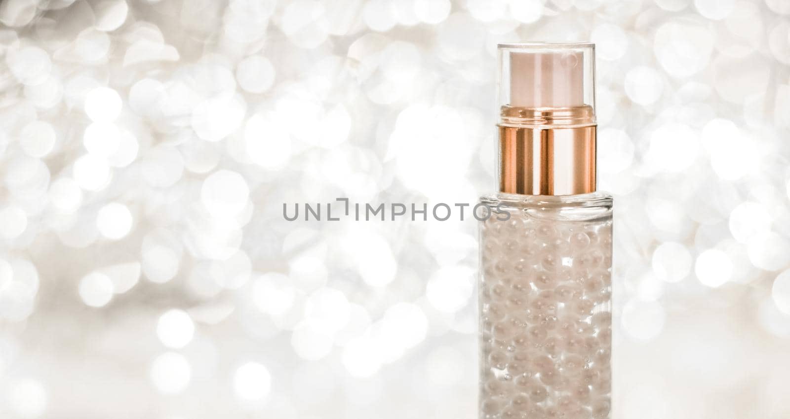 Cosmetic branding, blank label and glamour present concept - Holiday make-up base gel, serum emulsion, lotion bottle and silver glitter, luxury skin and body care cosmetics for beauty brand ads