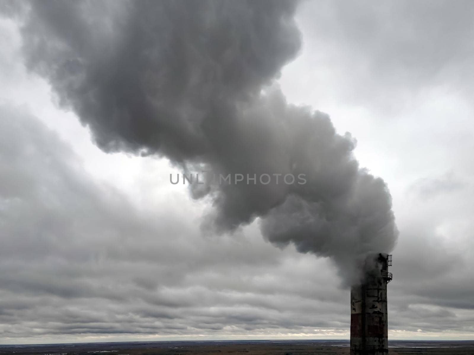 Atmospheric pollution,harmful emissions and global warming,ecological problem.Smoky chimneys of the power plant aerial view.Electric power generation,power plant for burning coal.Thick smoke from fuel by YevgeniySam