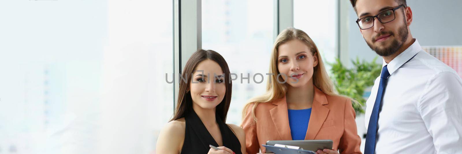 Portrait of confident team of successful people, men and women employees pose for collective picture. Coworkers in trendy suits. Business, teamwork concept