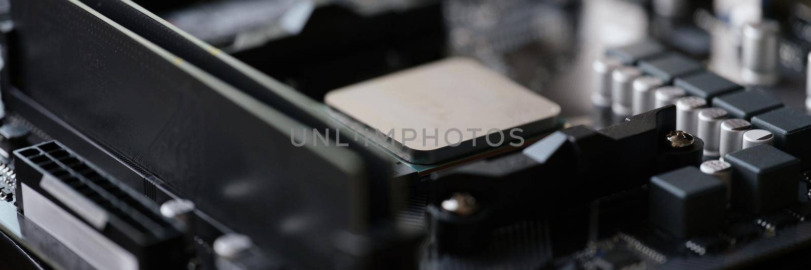 Tiny silver detail in computer processor, computer motherboard with all component by kuprevich