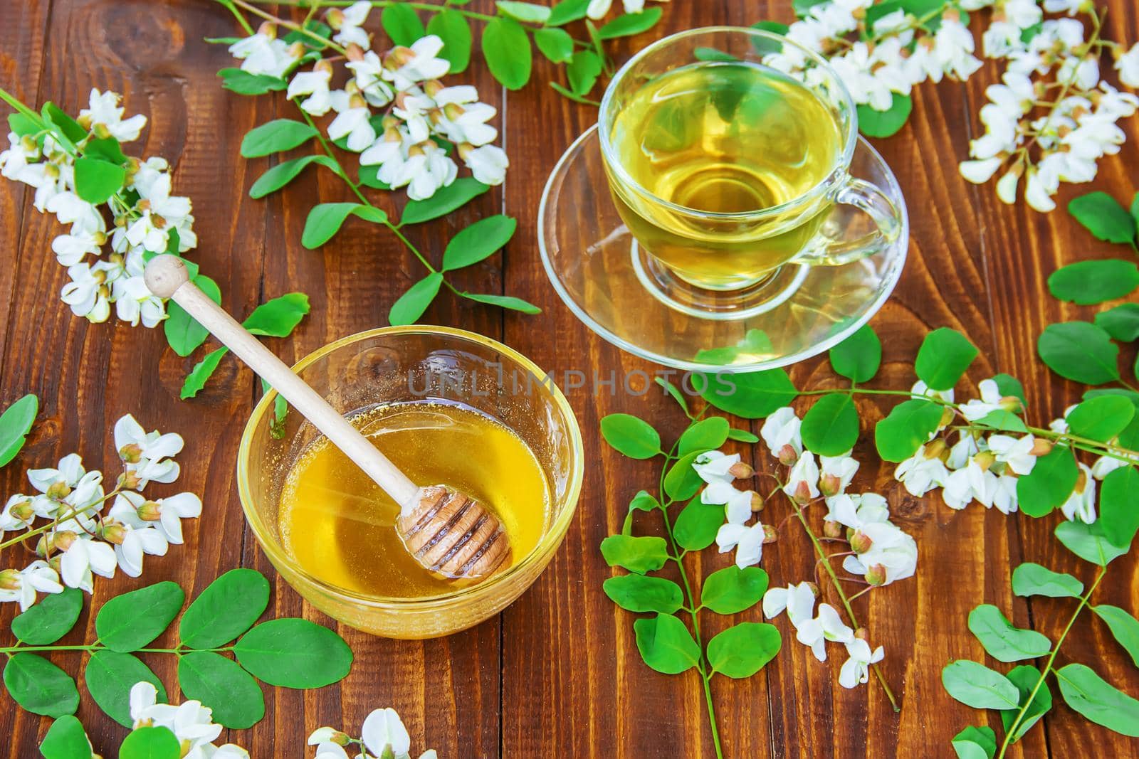 Honey with acacia and tea. Selective focus.