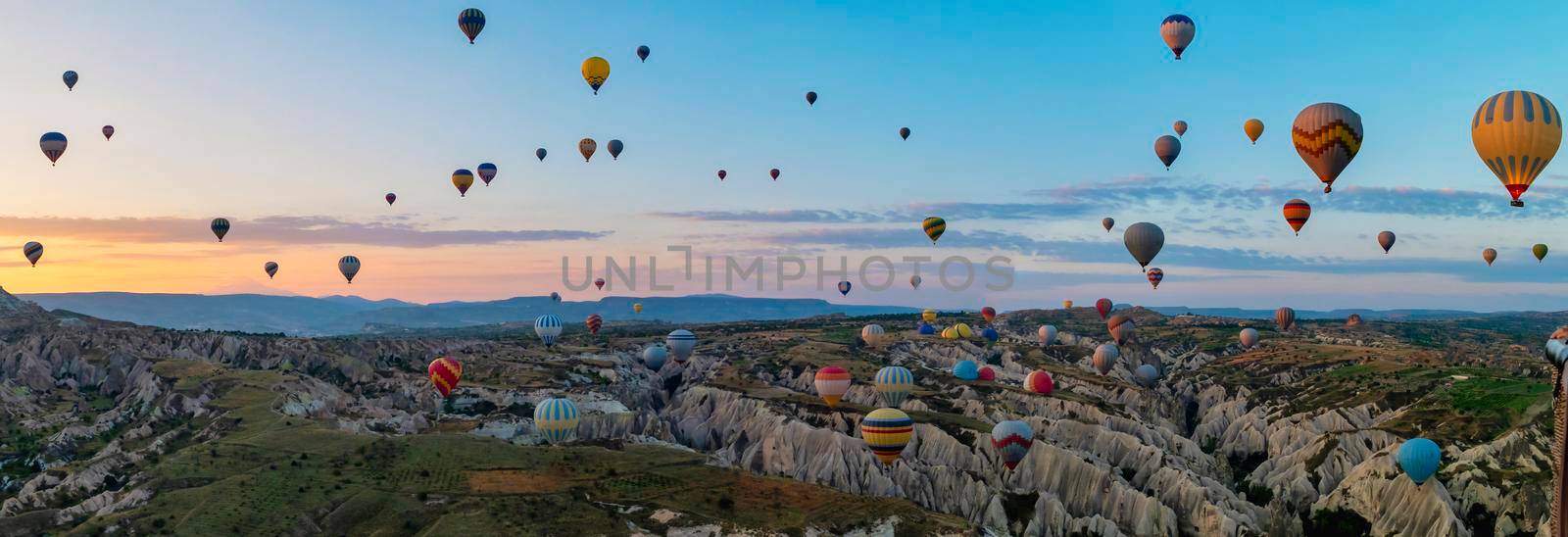Sunrise with hot air balloons in Cappadocia, Turkey balloons in Cappadocia Goreme Kapadokya, and Sunrise in the mountains of Cappadocia.