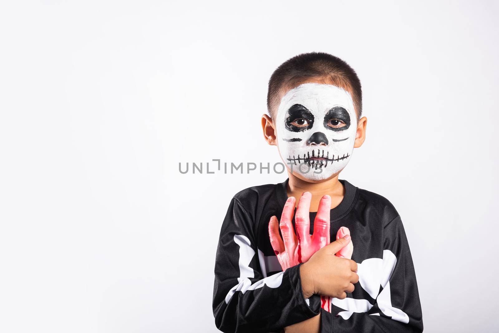 Halloween Kid. Portrait of Asian little kid boy wearing skeleton costume studio shot isolated white background, Child man horror face painting make up for scary, Happy halloween day concept