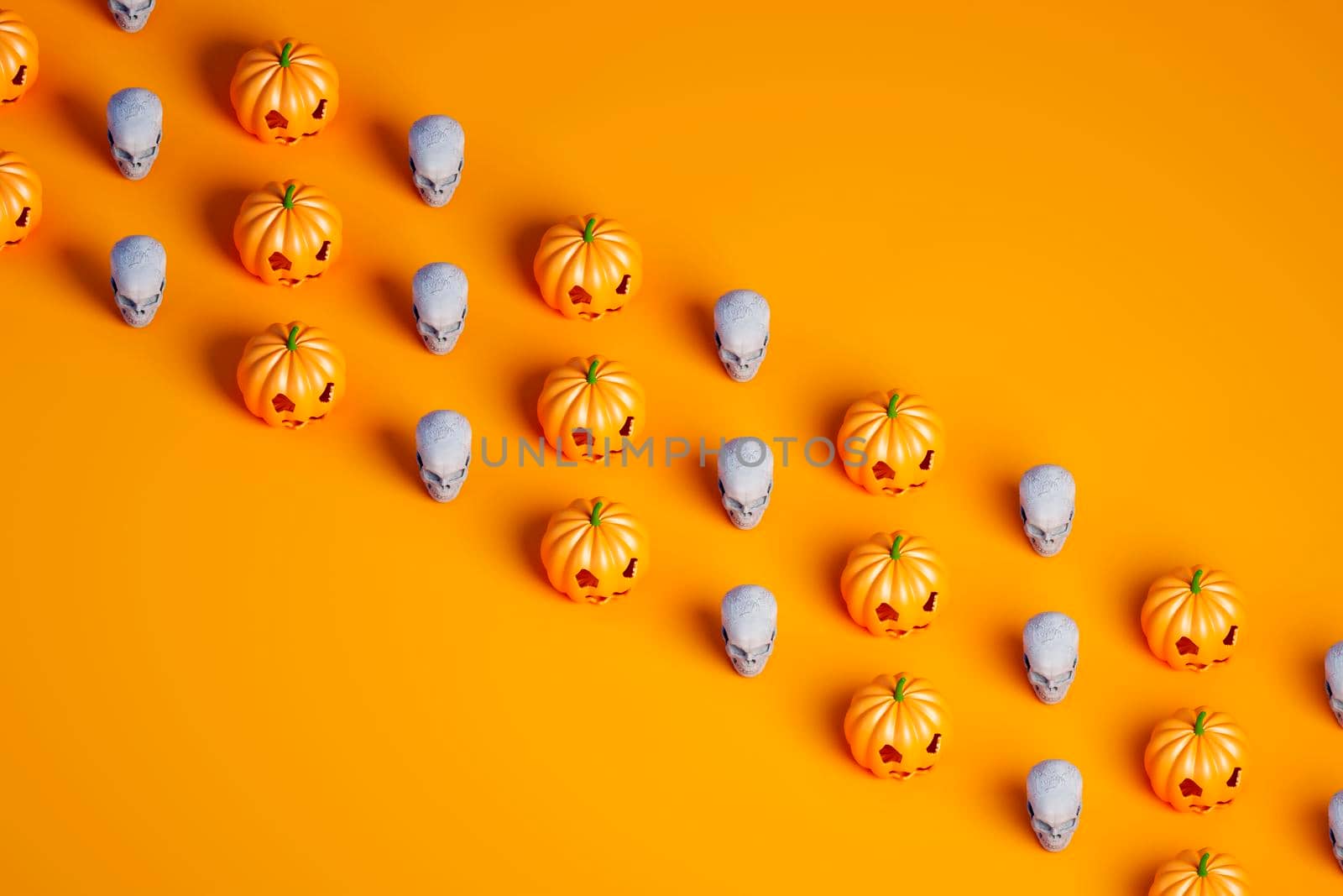 Three rows of many Halloween pumpkin and skulls on orange background 3d illustration by raferto1973