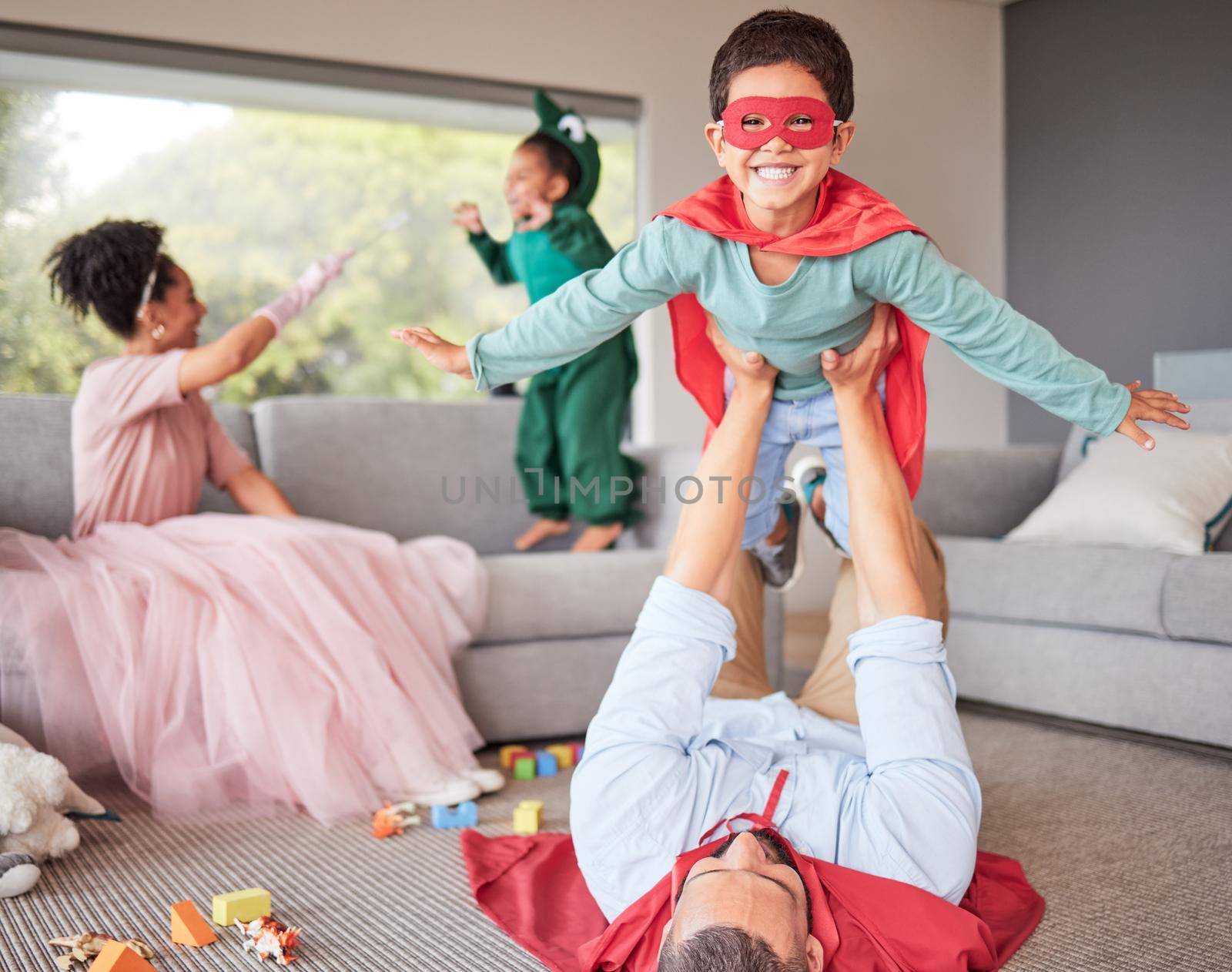Happy parents and children in costume playing, bonding and having fun together in living room. Happiness, excited and family enjoying fantasy dress up for halloween entertainment with kids at home