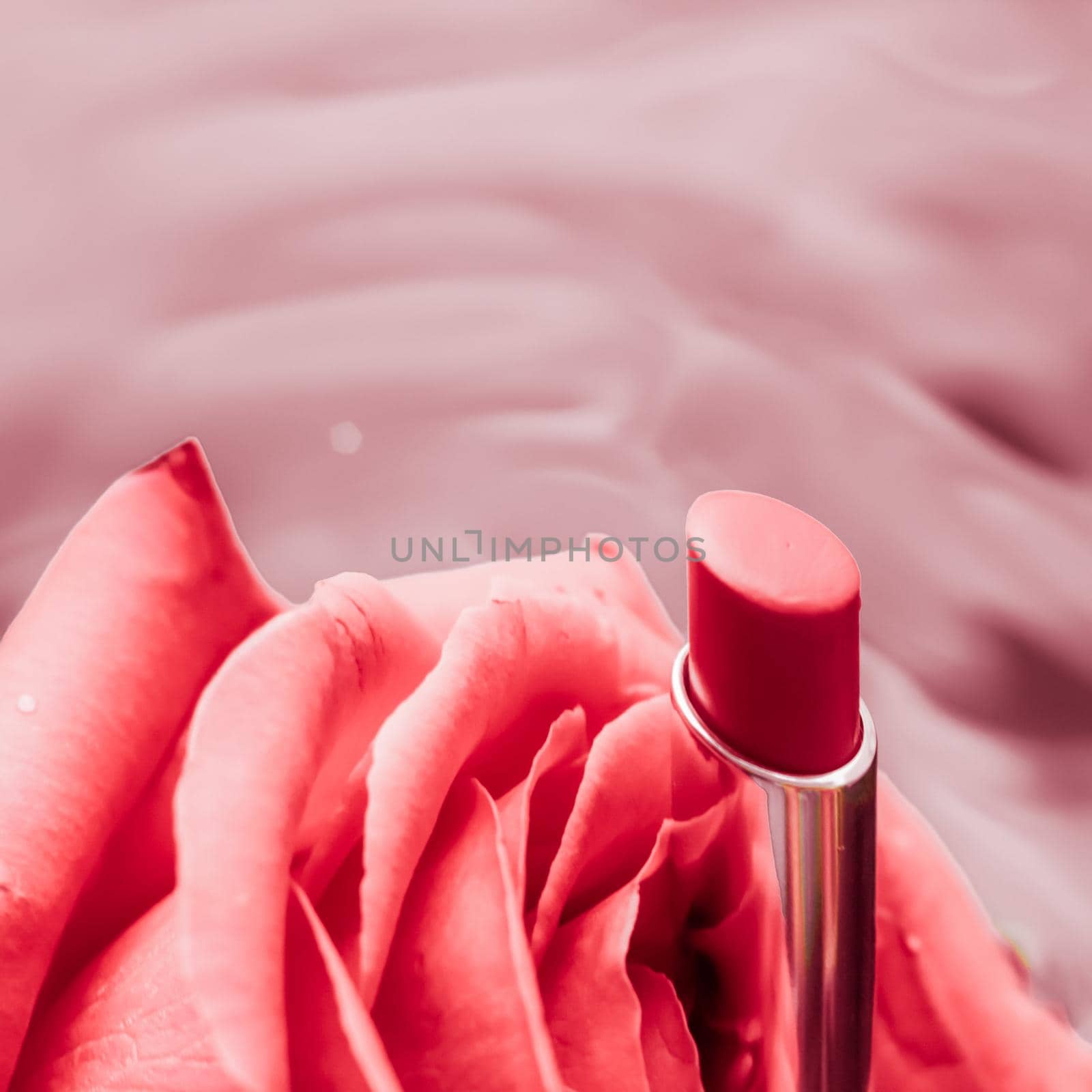 Cosmetic branding, luxe and fashion concept - Pink lipstick and rose flower on liquid background, waterproof glamour make-up and lip gloss cosmetics product for luxury beauty brand holiday design