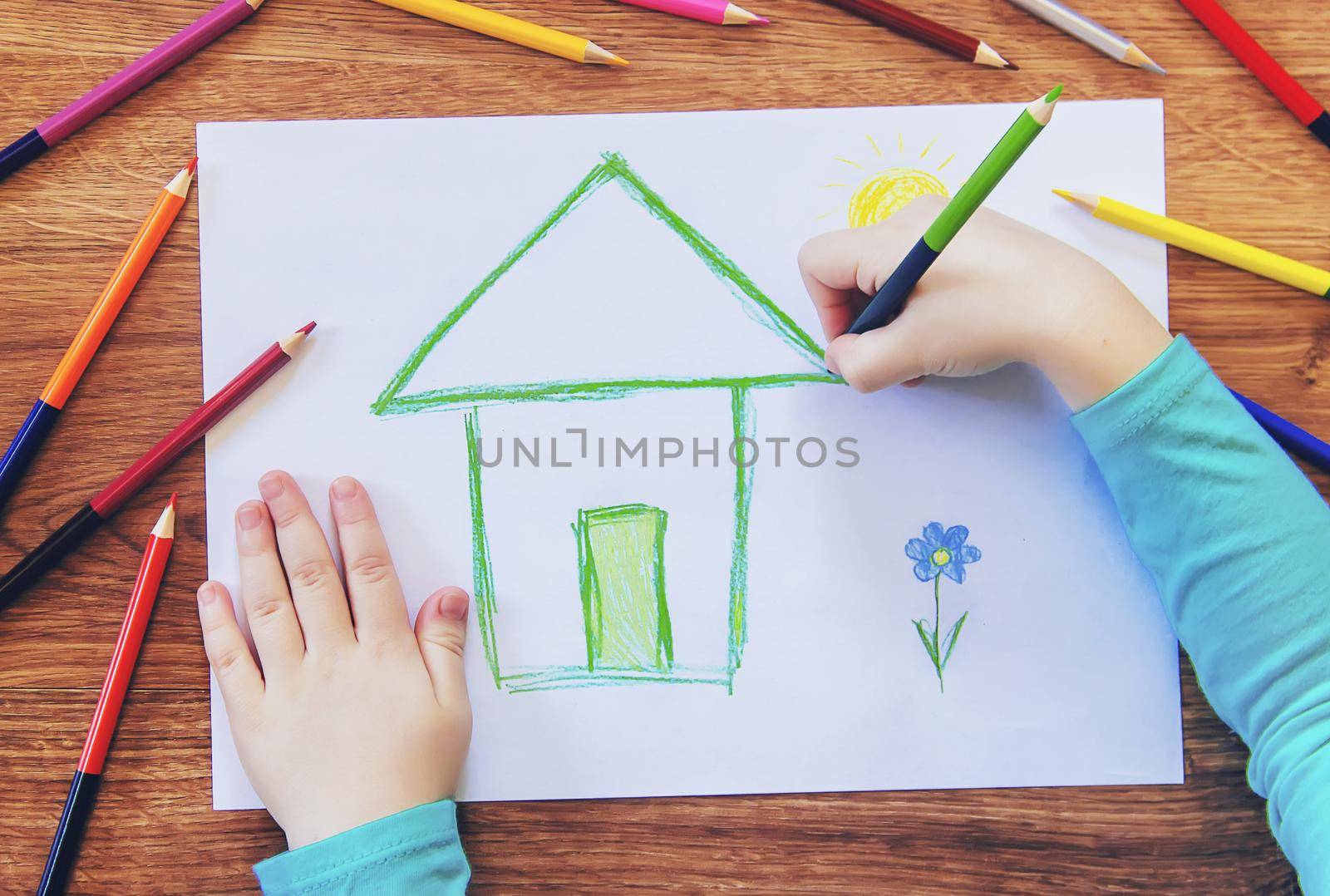 draw child house family. Selective focus. by yanadjana