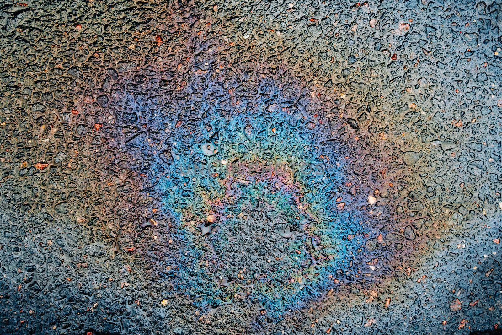 Traces and Stains of Oil or Gasoline on the Asphalt on the Road or Sidewalk