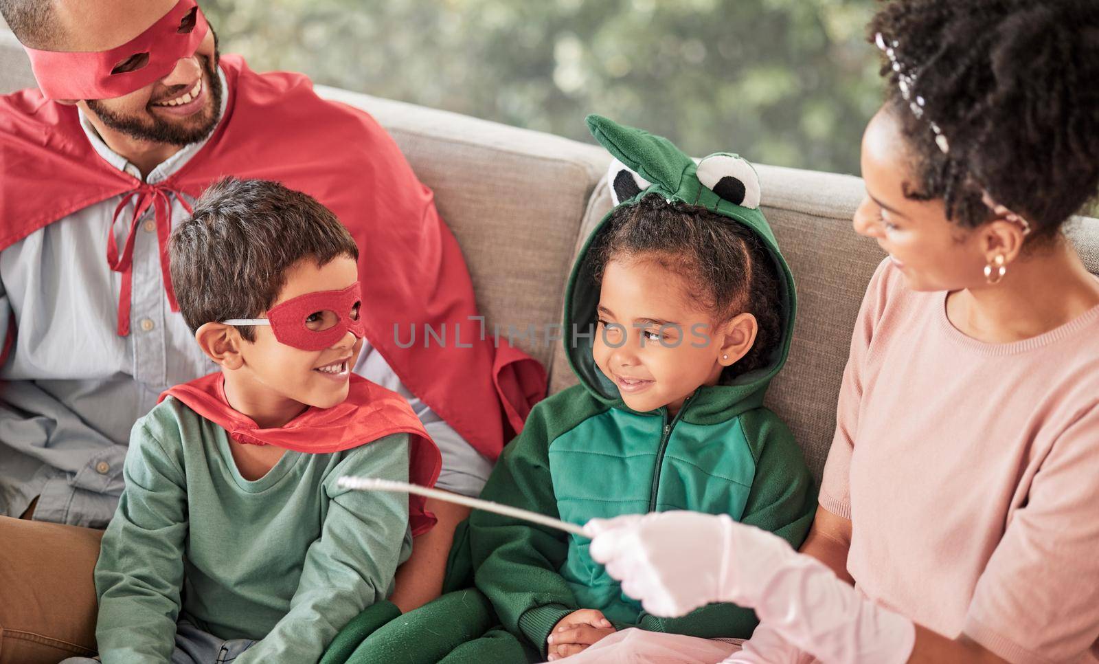 Happy family, halloween and bonding on a sofa with children looking happy and excited in their costume. Love, creativity and fun parents playing with their kids in a living room, relax and playful.