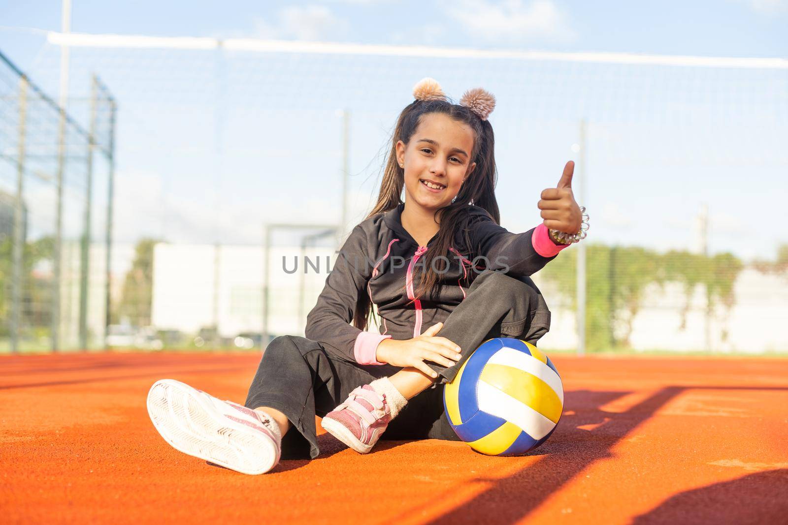 Pretty teen girl with brunette hair, volleyball ball by Andelov13