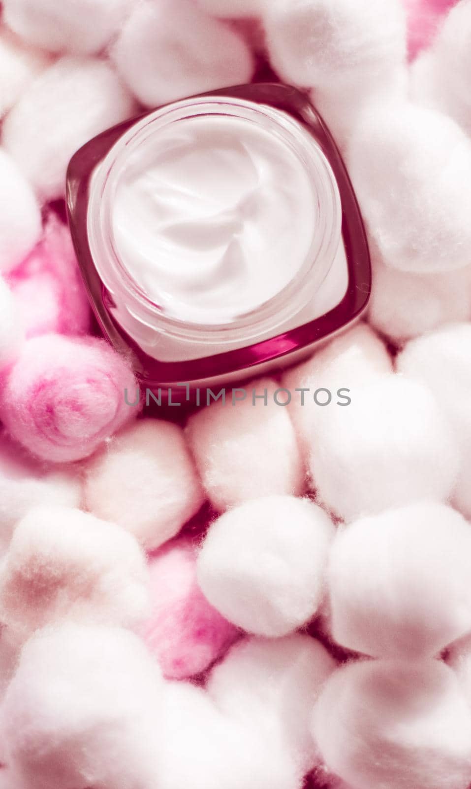 Cosmetic branding, moisturizing emulsion and facial care concept - Luxury face cream for sensitive skin and pink cotton balls on background, spa cosmetics and natural skincare beauty brand product