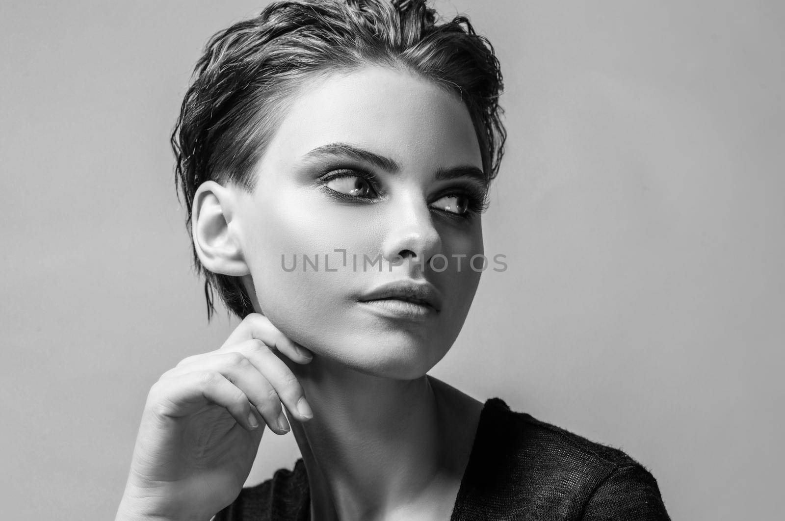 Monochrome portrait of an attractive girl with healthy skin and hair