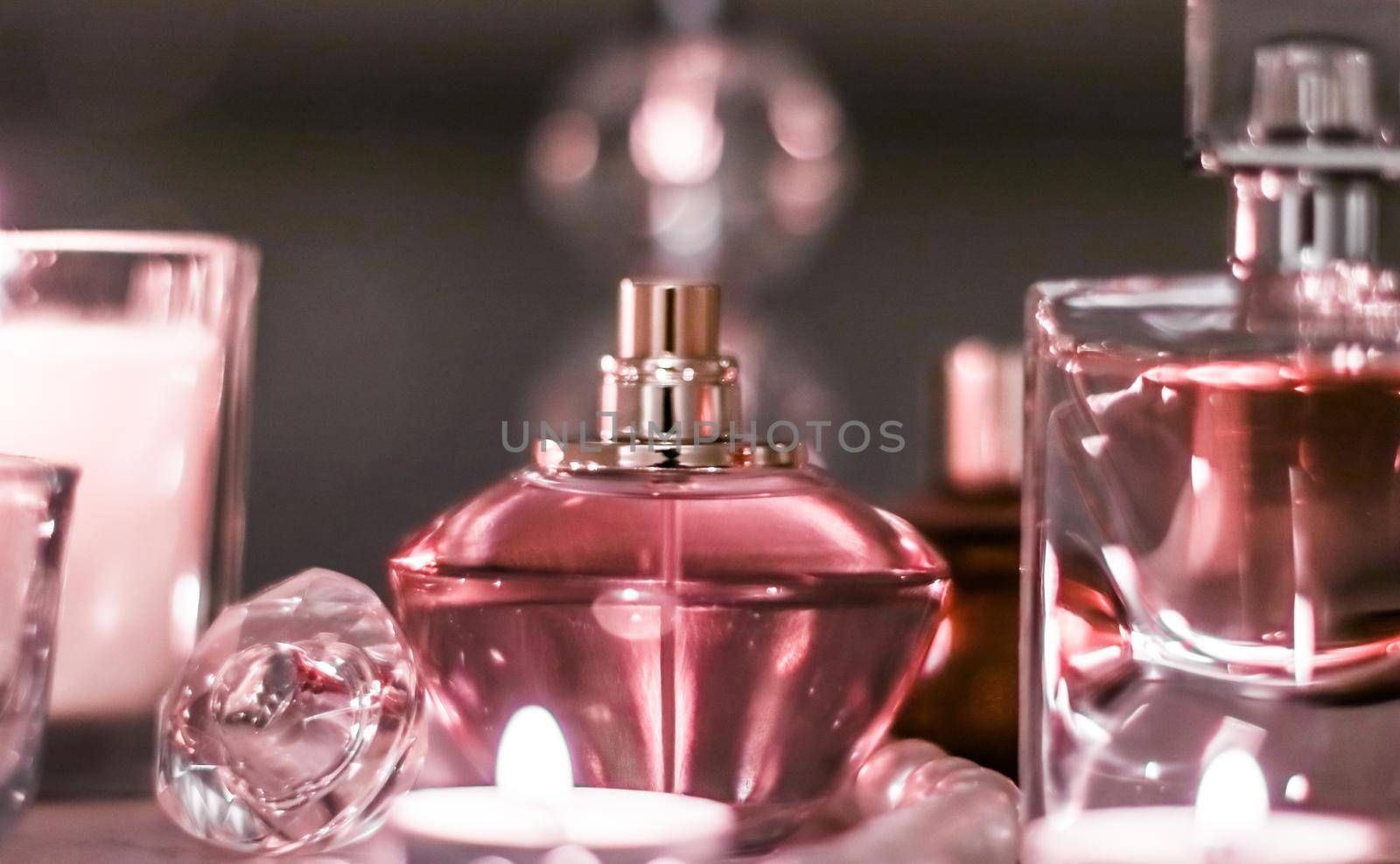 Perfumery, cosmetics branding and luxe concept - Perfume bottle and vintage fragrance on glamour vanity table at night, pearls jewellery and eau de parfum as holiday gift, luxury beauty brand present