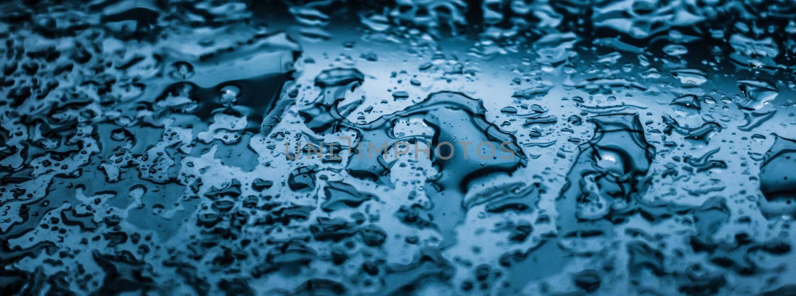 Water texture abstract background, aqua drops on blue glass as science macro element, rainy weather and nature surface art backdrop for environmental brand design by Anneleven