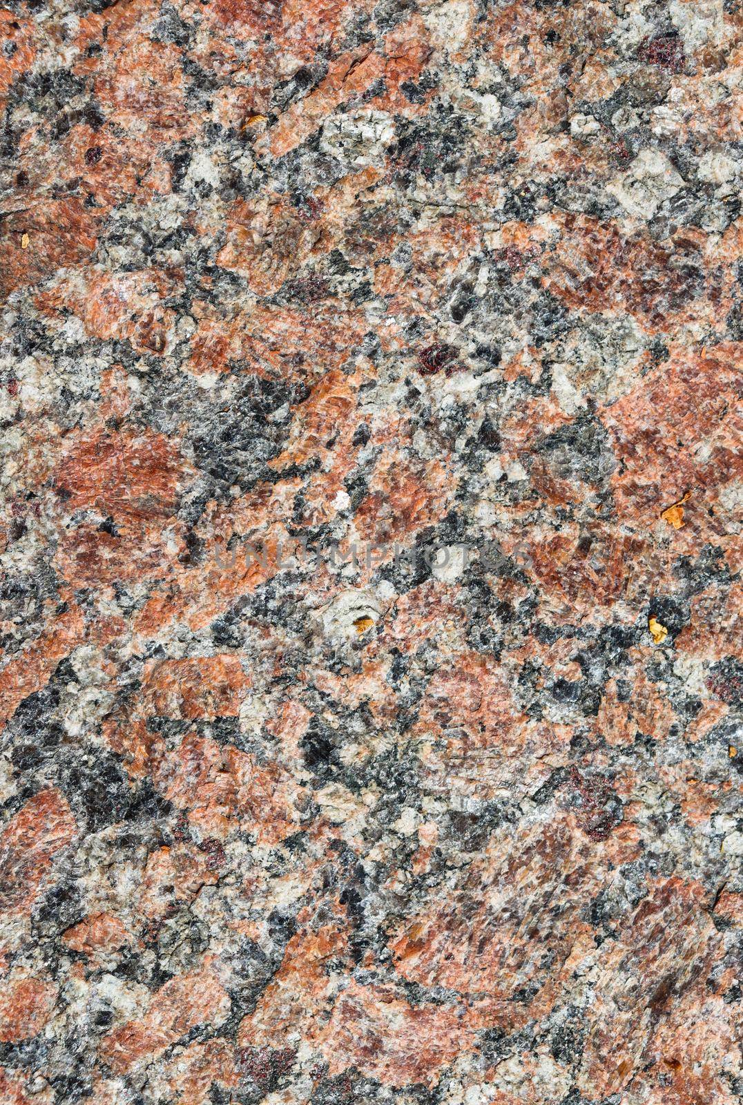 Texture for design with copy space. The texture of the granite stone surface in close-up.