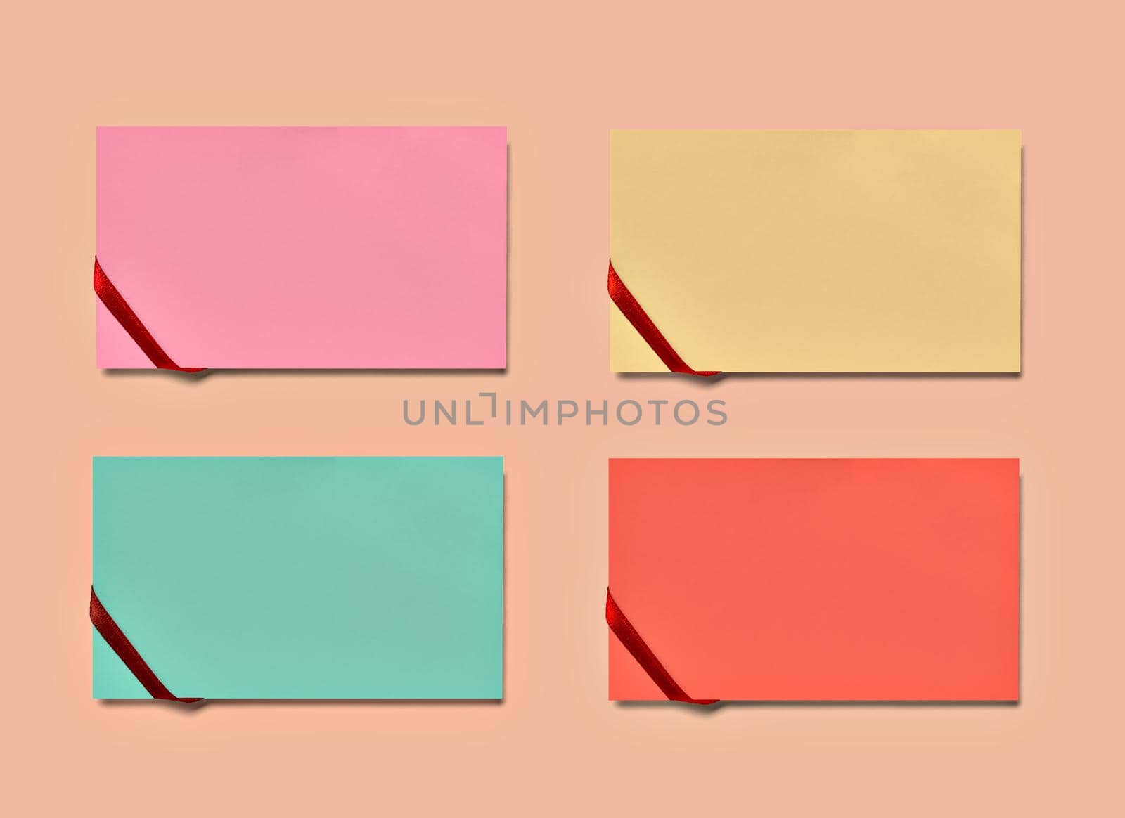 close up of a note paper greeting card with ribbon bow on pastel color background background