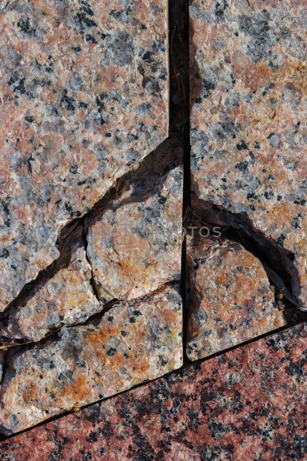 Abstract background of damaged stone floor with cracks.